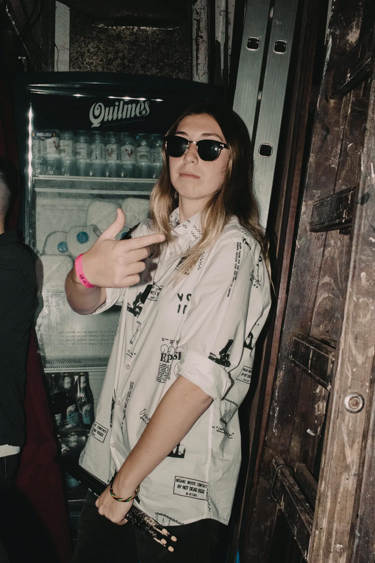 Julia backstage in Buenos Aires, next to a Quilmes fridge